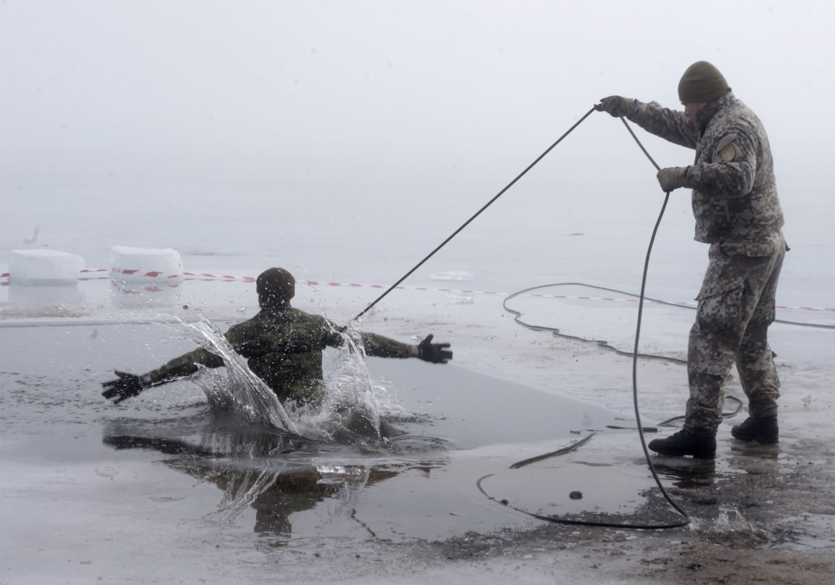 a-canadian-soldier-in-latvia-takes-part-in-ice-plunge-training-as-part-of-nato-exercise-operation-atlantic-resolve