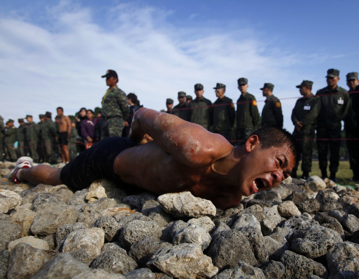 in-taiwan-in-order-to-pass-the-final-stage-of-a-nine-week-amphibious-training-program-a-trainee-crawls-along-a-150-foot-path-of-jagged-coral-and-rocks-on-his-belly