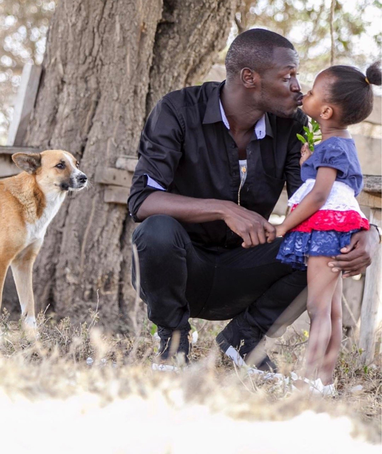 King kaka kissing his baby girl