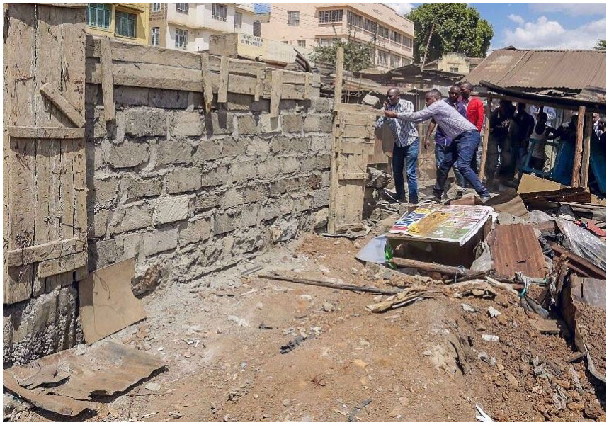 Jaguar embraces goon mentality as he leads a group of young men to pull down a perimeter wall (Photos)