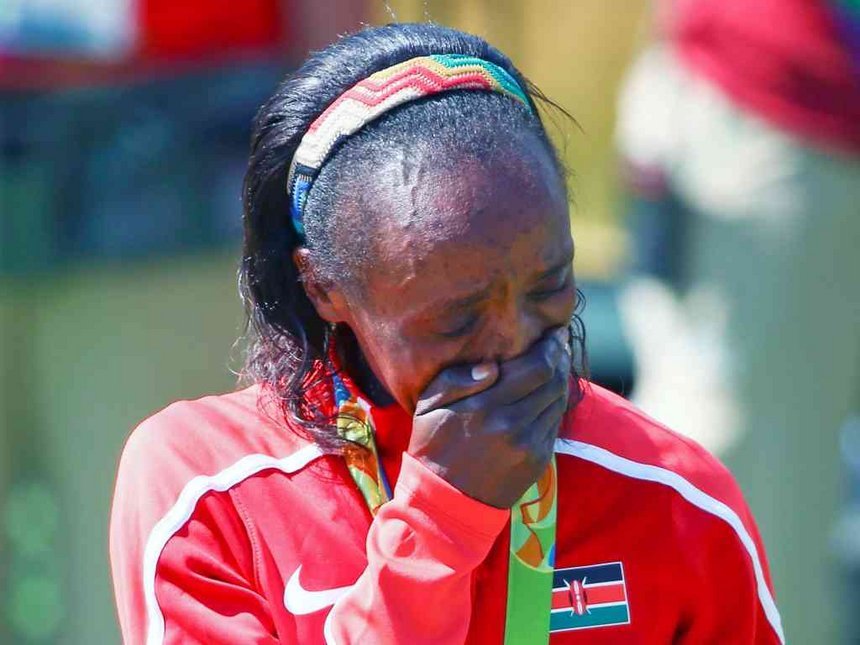 Kenyan athlete leaves many questioning whether she bleached her face & forgot to do the same on her hands