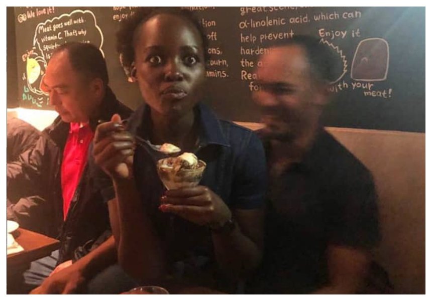 New boyfriend? Lupita Nyong’o leaves internet guessing after she is seen seated on a man’s lap at a restaurant (Photos)