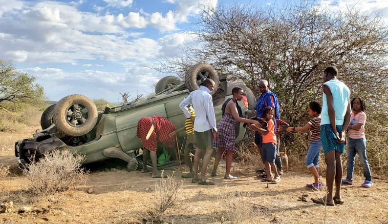 Boniface Mwangi slaughters goat at accident scene after escaping unhurt (photos)